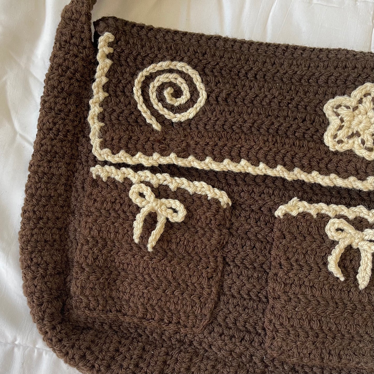 Brown swirl messenger bag