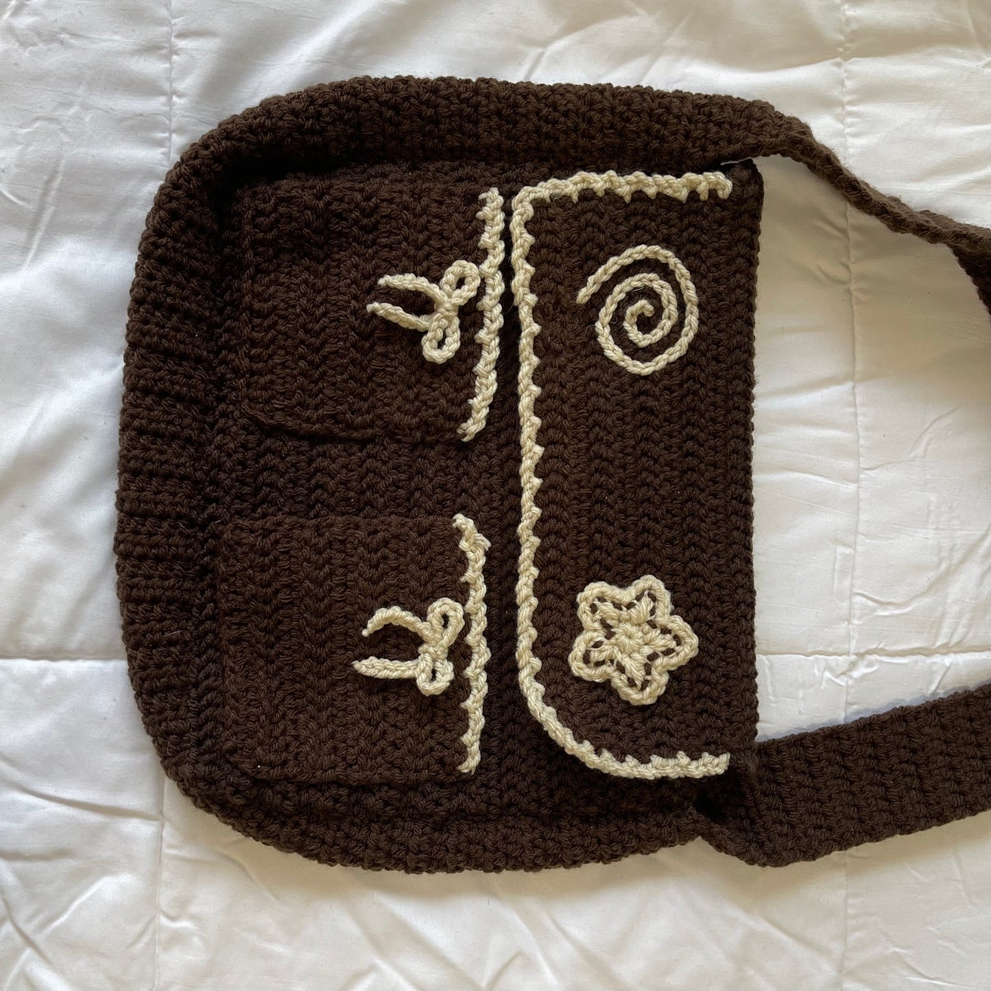 Brown swirl messenger bag