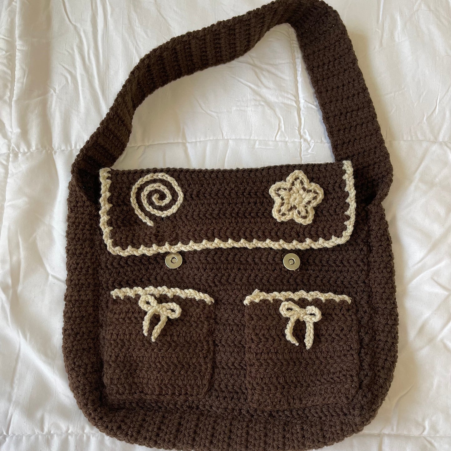 Brown swirl messenger bag