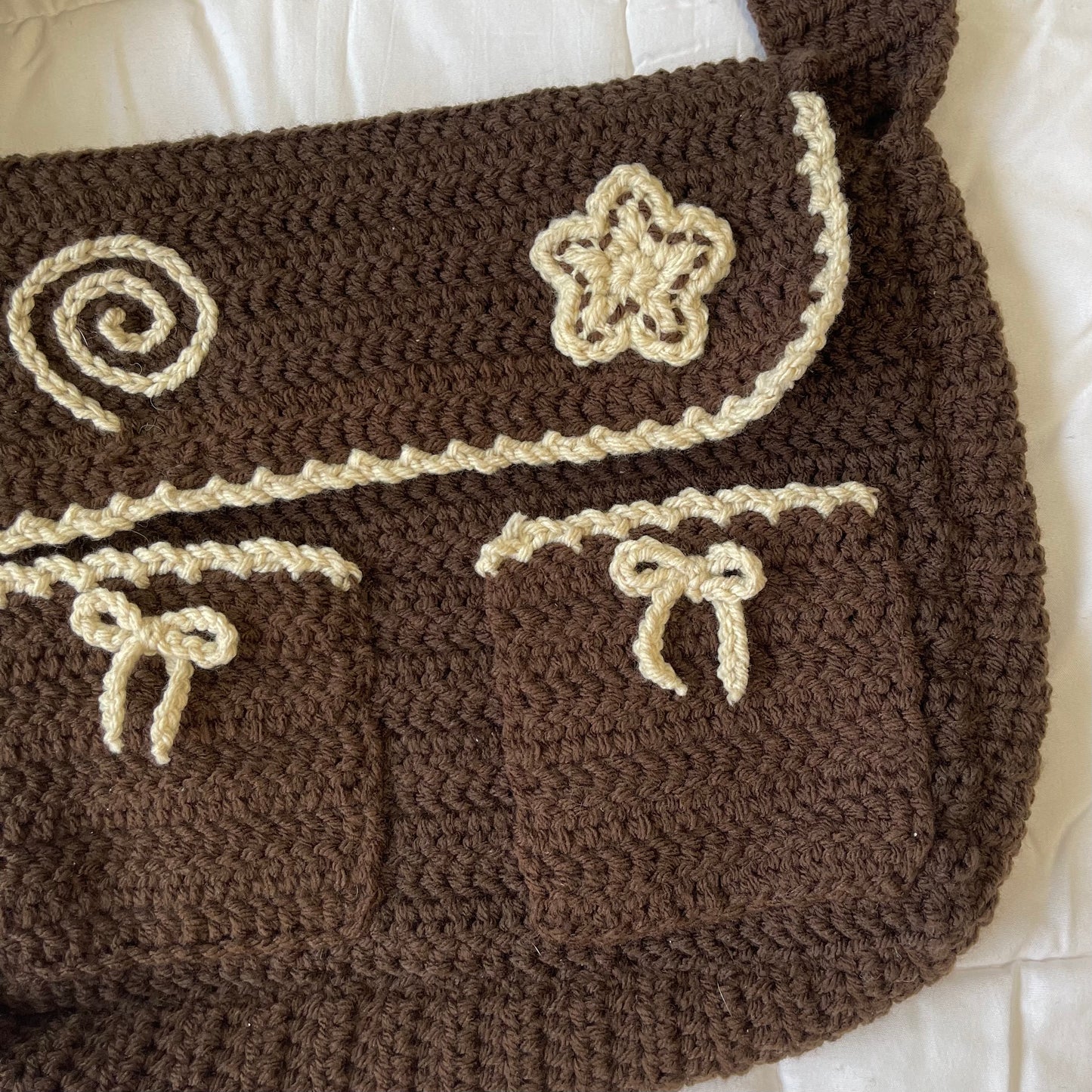 Brown swirl messenger bag